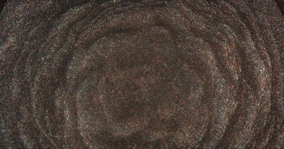 Shiny pulsating clouds or waves of vibrating glittering brown particles flowing inwards