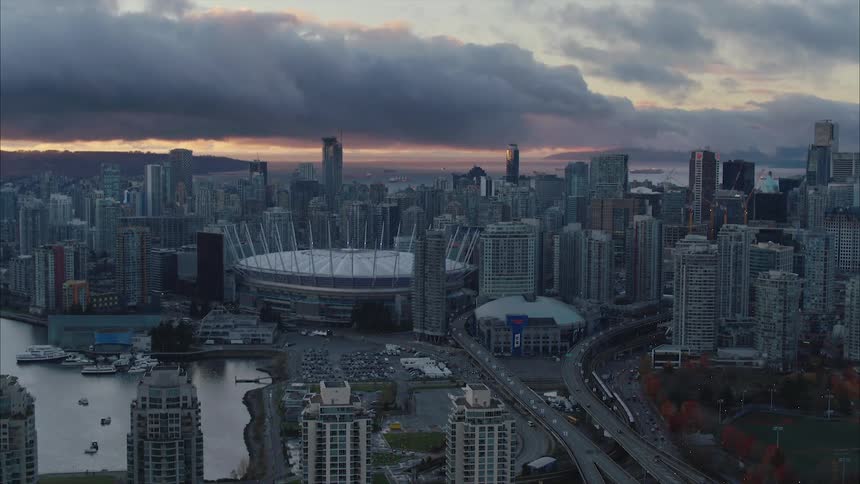 Aerial view of BC Place stadium in the middle of Vancouver's downtown at sunset