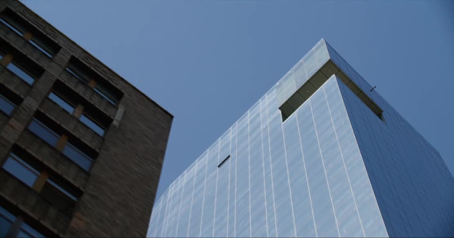 Exterior view of high rise building against the blue sky in the city
