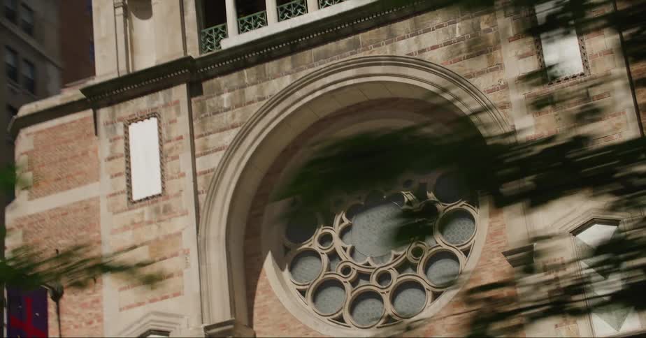 Exterior view of church door and apartment buildings in the city