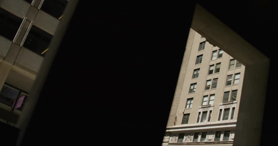 Twisting footage of tall skyscrapers on the city downtown at daytime