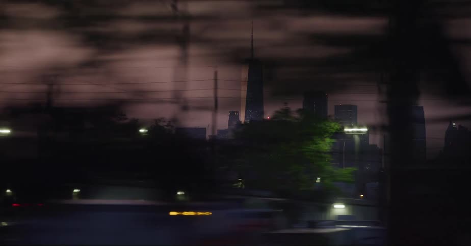 One world trade center in new york city seen from a moving vehicle at evening