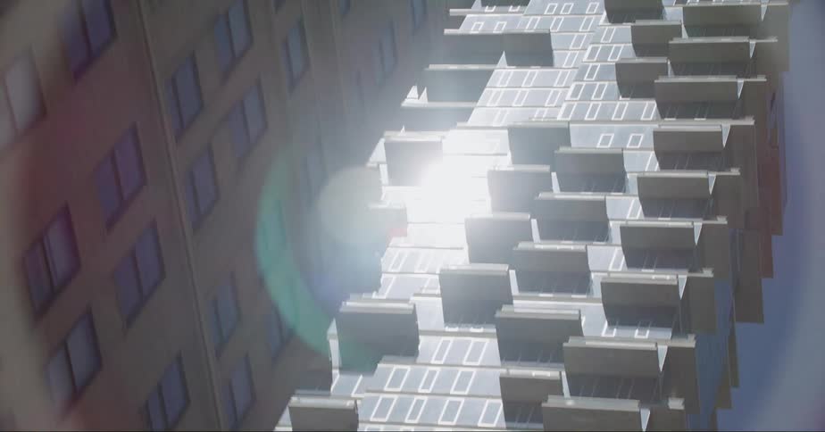 Footage of the jenga building in new york city seen from a moving vehicle at daytime
