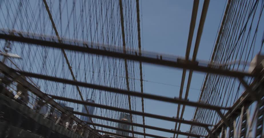 A suspension bridge runs past downtown
