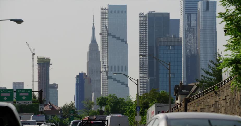 Traffic moves slowly on a highway in a city