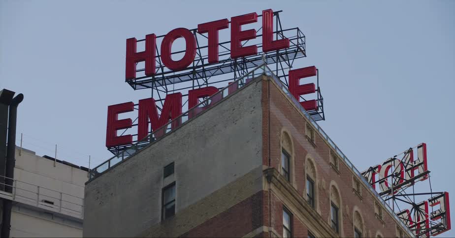 Exterior view of hotel building with hotel sign in the city