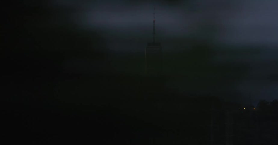 One world trade center seen from a moving car at evening