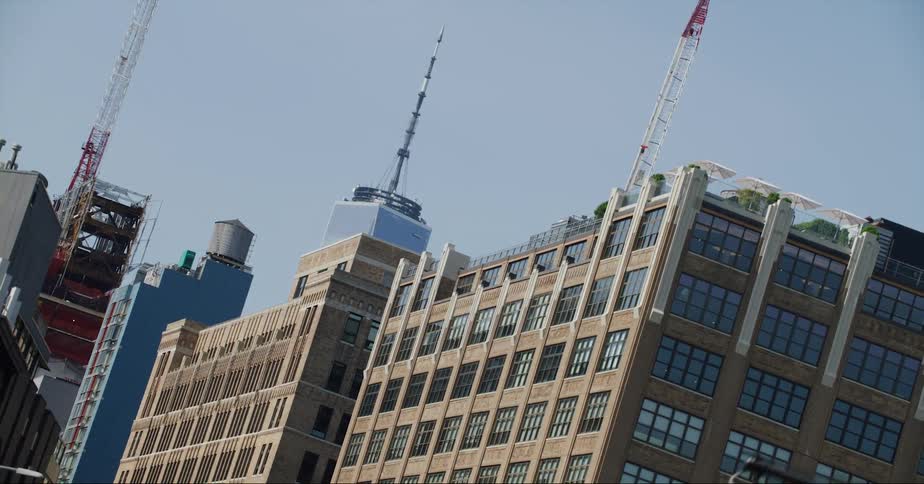 Cranes are on some of the tall buildings
