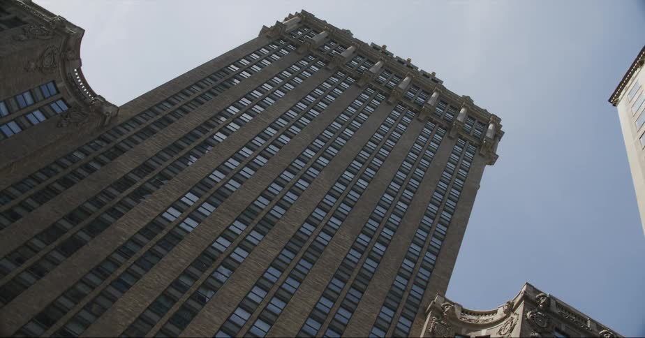 Exterior view of high rise building in the city against blue sky