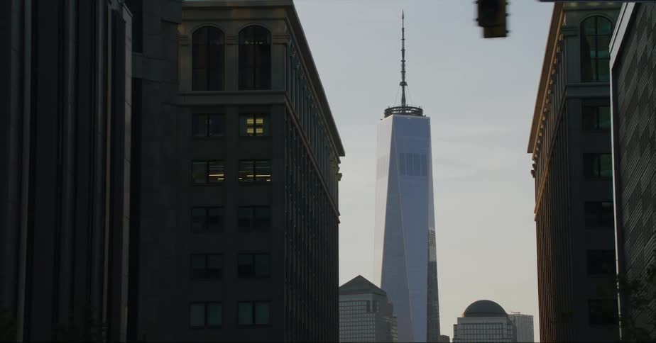 Exterior view of buildings and skyscraper with spire in the city