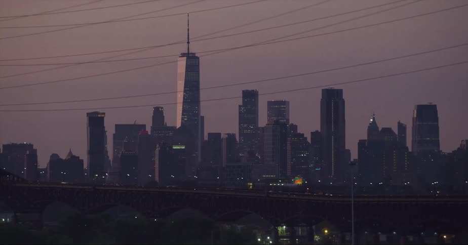 One world trade center tower standing tall in the new york city skyline at dusk