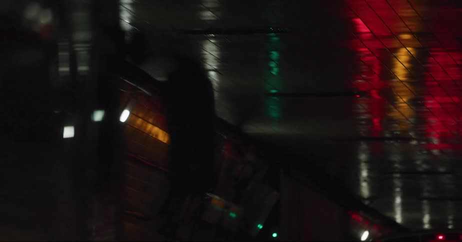 Buses and cars drive through tunnel