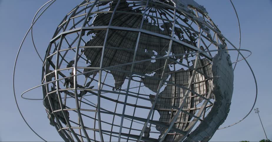 A large metal planet representing earth is made of a metal grid