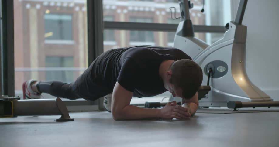 A man is exercising in a gym