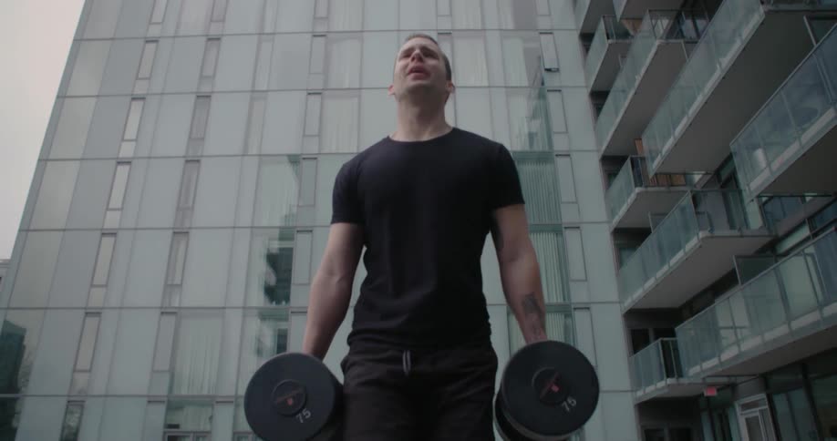 A person carries weights outside