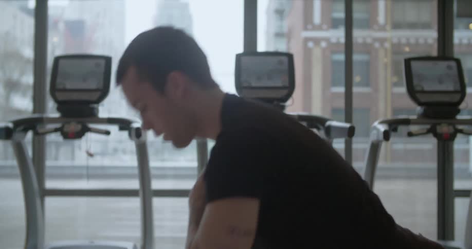 A man is doing exercises in a gym