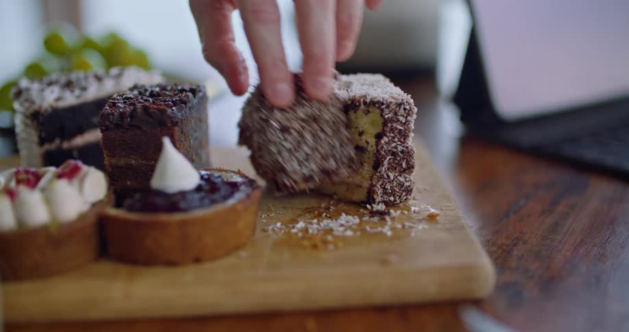 A person slicing a piece of cake