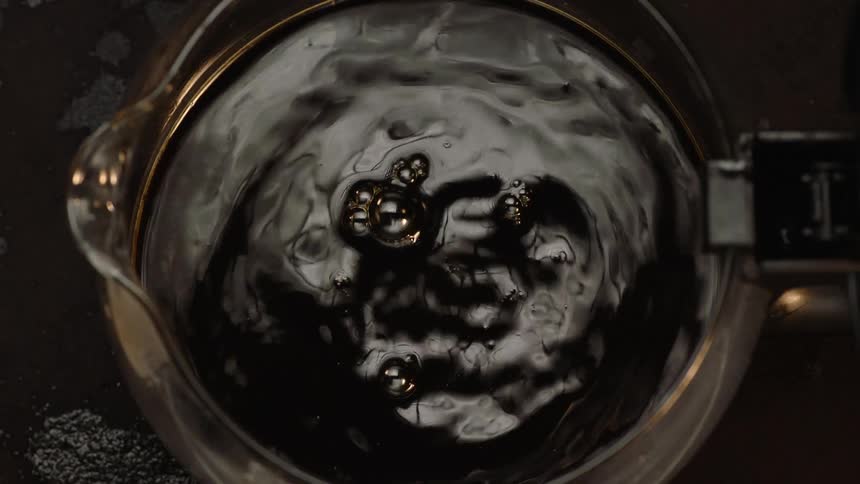 Coffee is poured into the pot