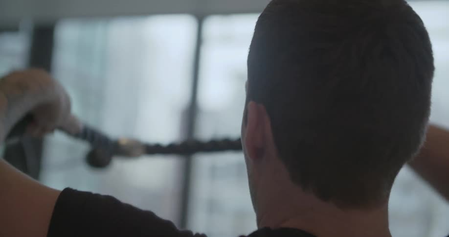 A man is exercising in a gym
