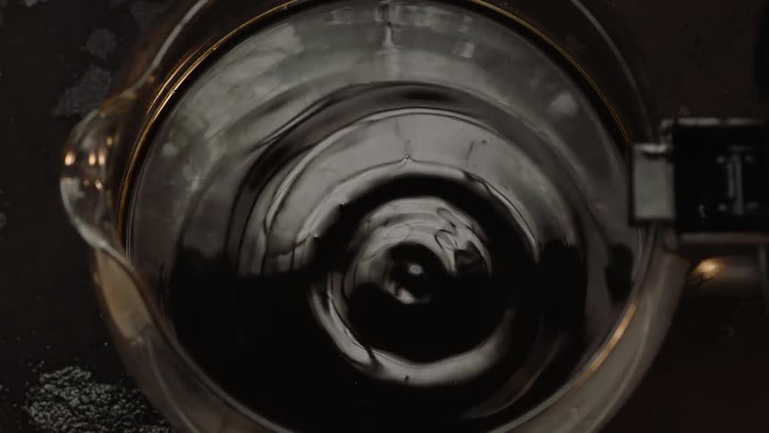 Coffee drips down coffee jug coffee