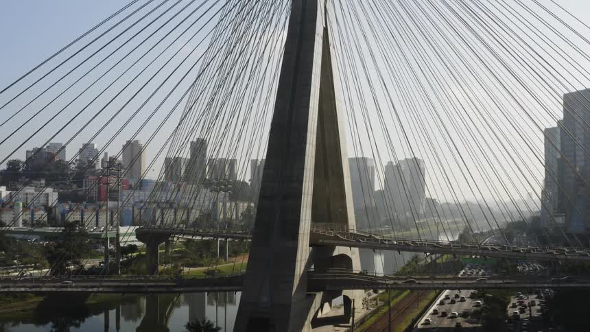 Vehicles travel on the bridge through the city
