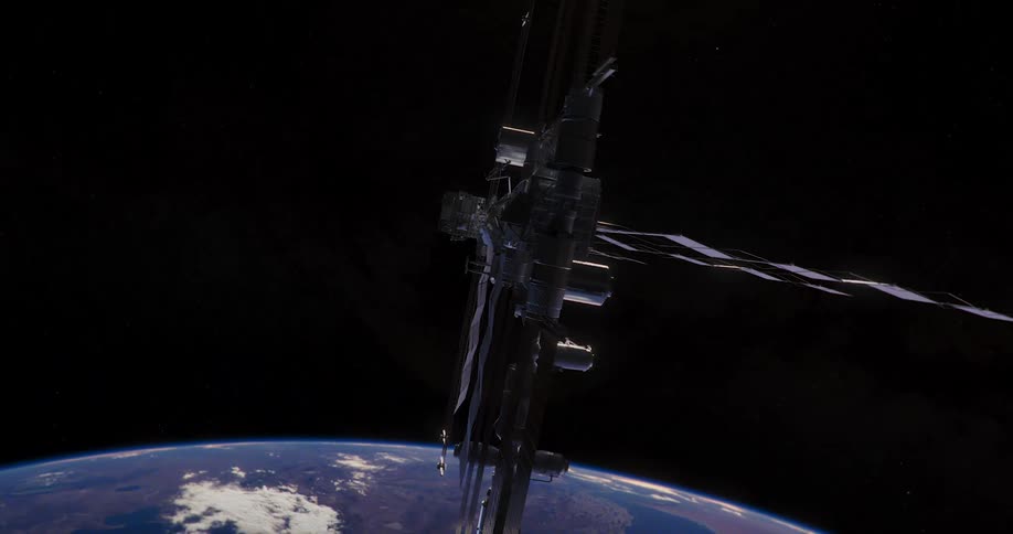 The space station spins in orbit above planet earth