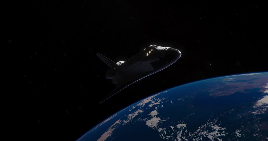 A space shuttle is floating in space and the planet earth is in the distance