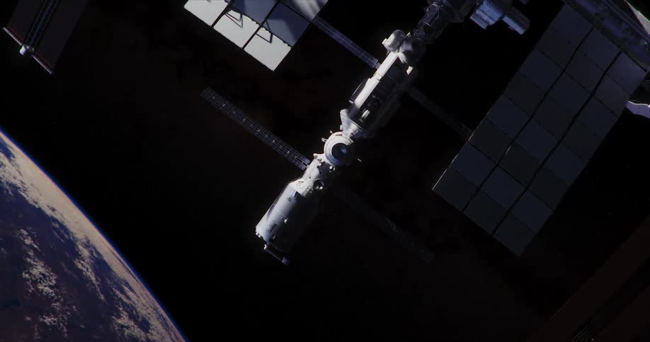 A space station flying above a planet