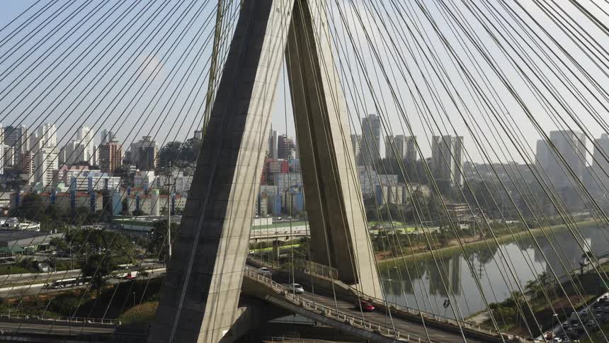 An incredibly intricately designed suspension bridge has a number of cables supporting roadways