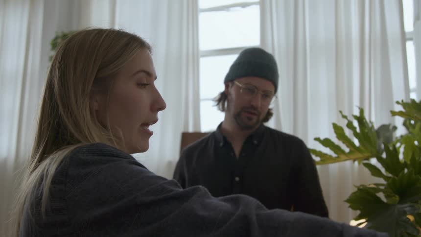 Woman gives presentation and discusses it with man