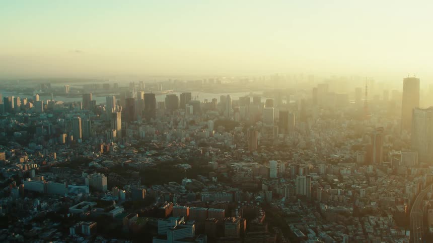 Heavy smog fills the sky over a coastal city