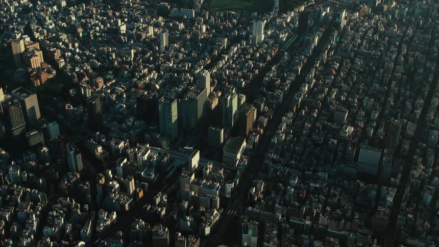 An aerial view of a large city with tall buildings