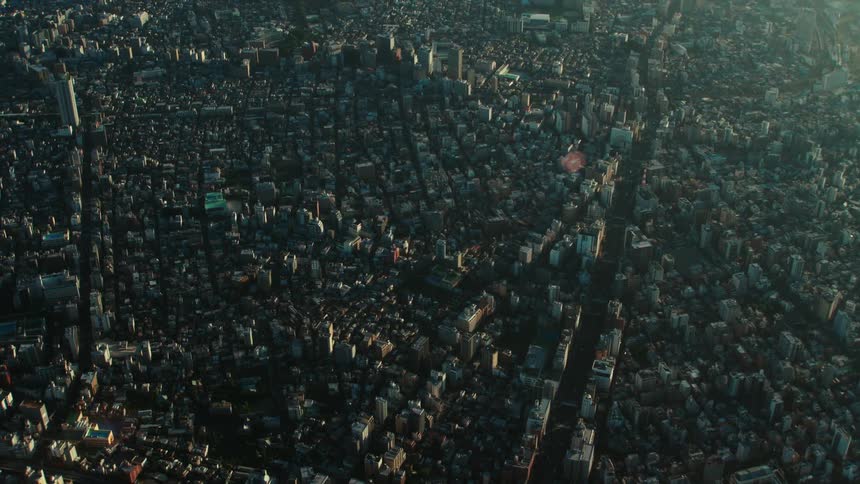 The rooftops buildings and streets of a densely populated city