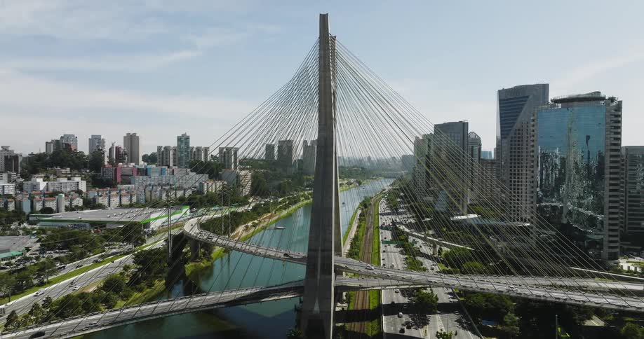 An aerial view of a city with a bridge
