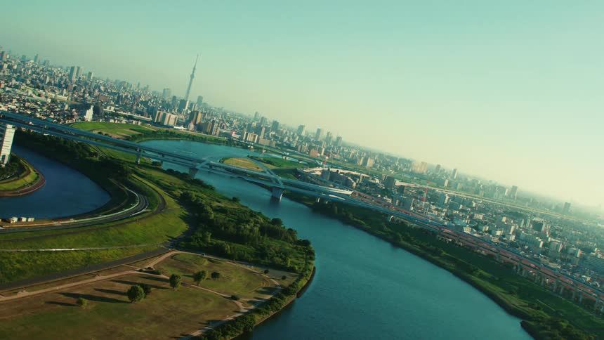 Bridges line the river before the city