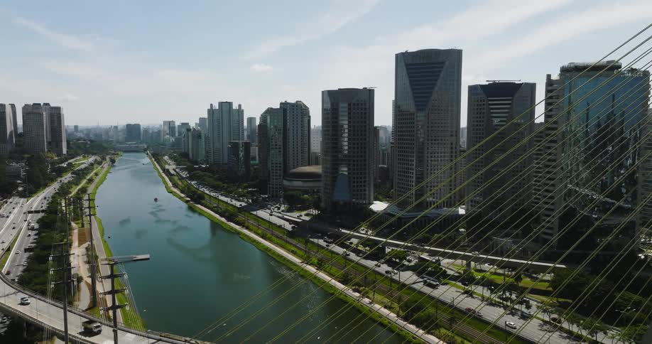 Cars and traffic on sao paulo city highways on both sides of the pinheiros river