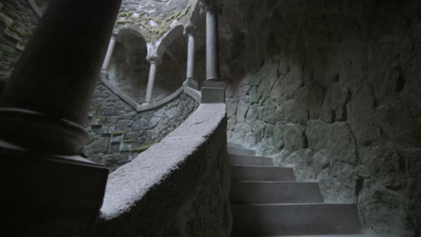 A stone staircase winds upwards