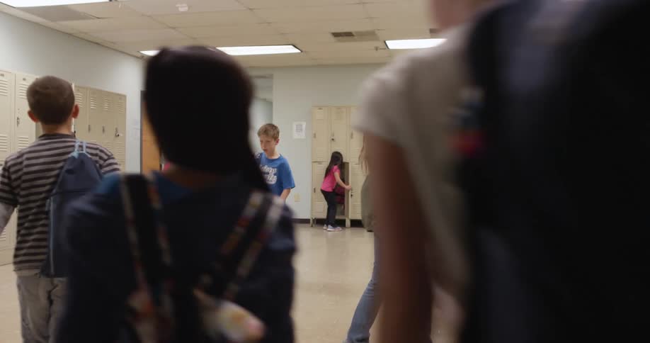 A group of kids are going to their lockers at school