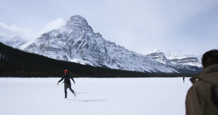 People run around in the snow on a winter day