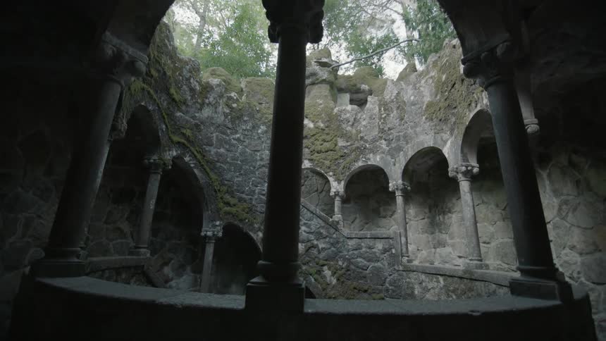 A stone staircase goes below