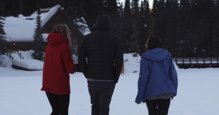 A group of people walking in a snowy place