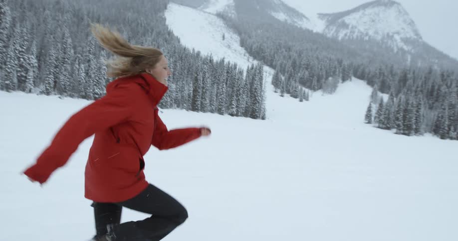 A woman running through the snow