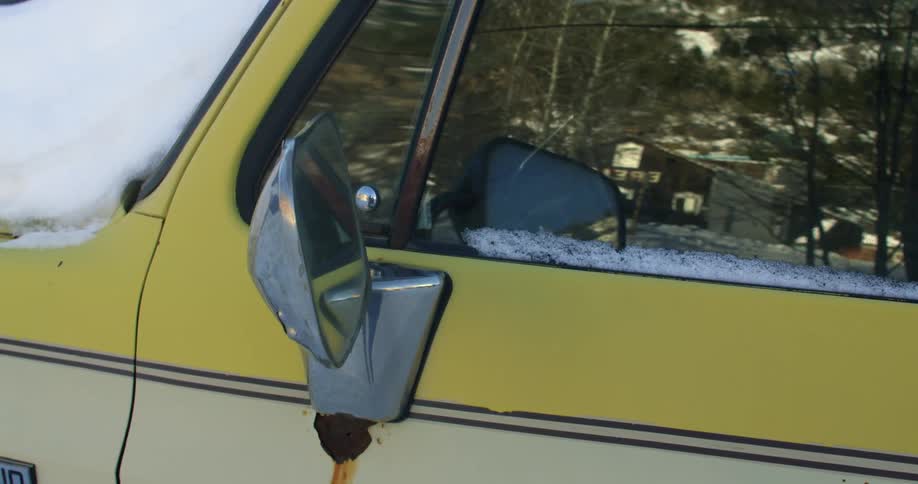 View of a car covered with snow