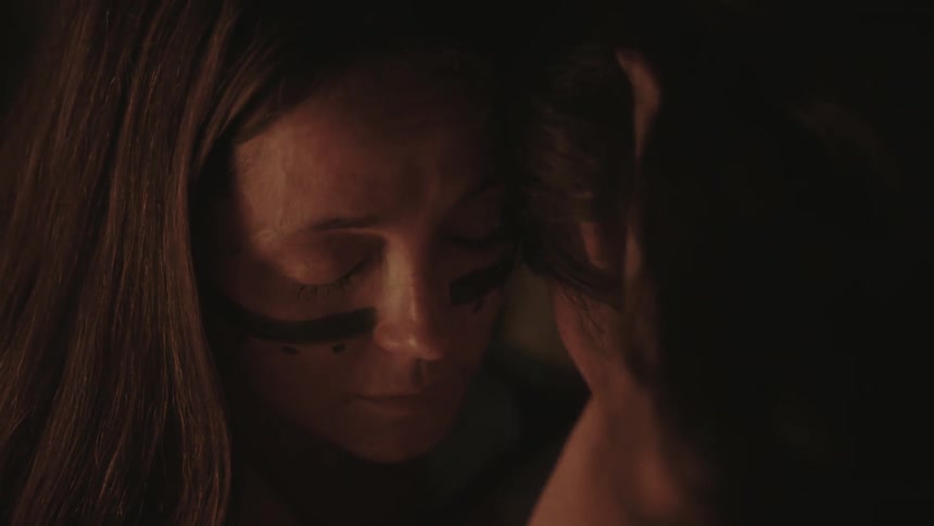 A man and woman touch foreheads