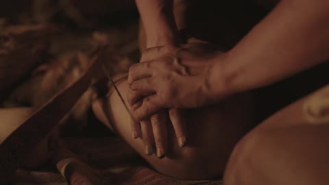 A person touches another person's hand