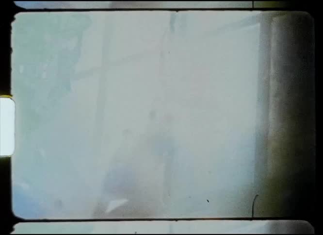 A woman moving around in a room