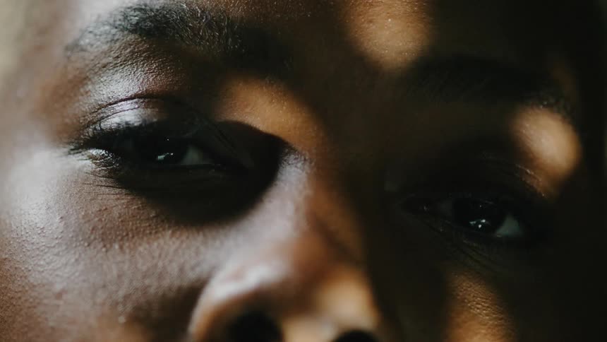 Close up of woman with short hair staring at camera