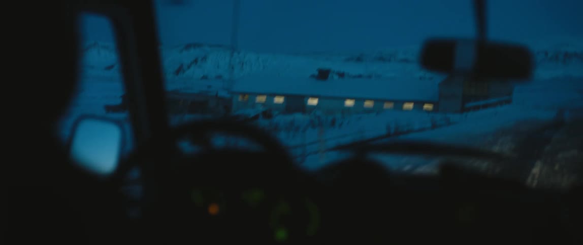 A person is driving in the snow