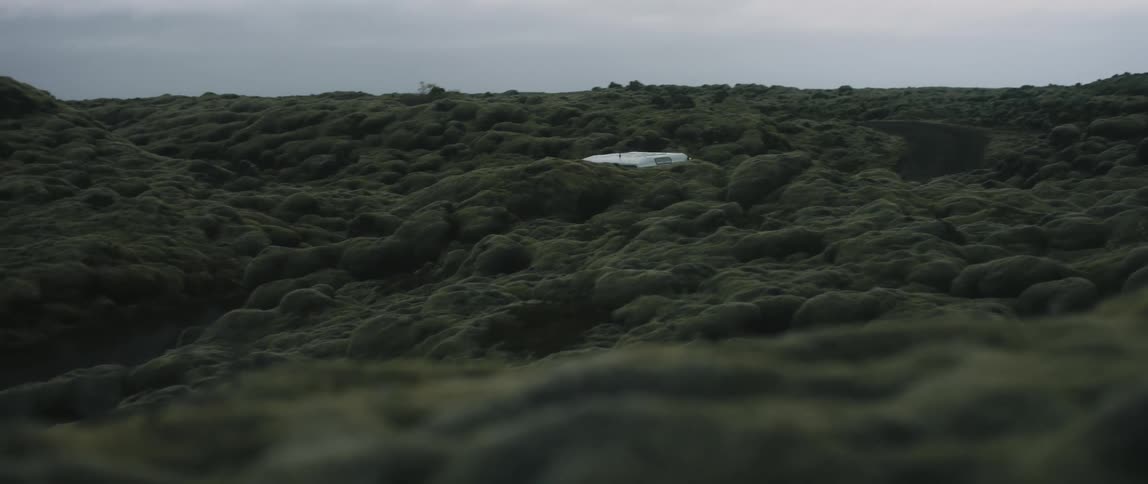The truck drives through the hills