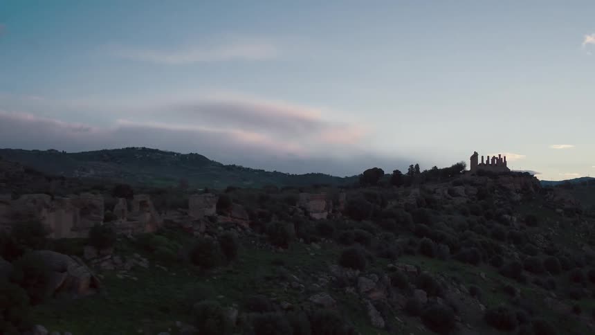 A bushy hill near sunset